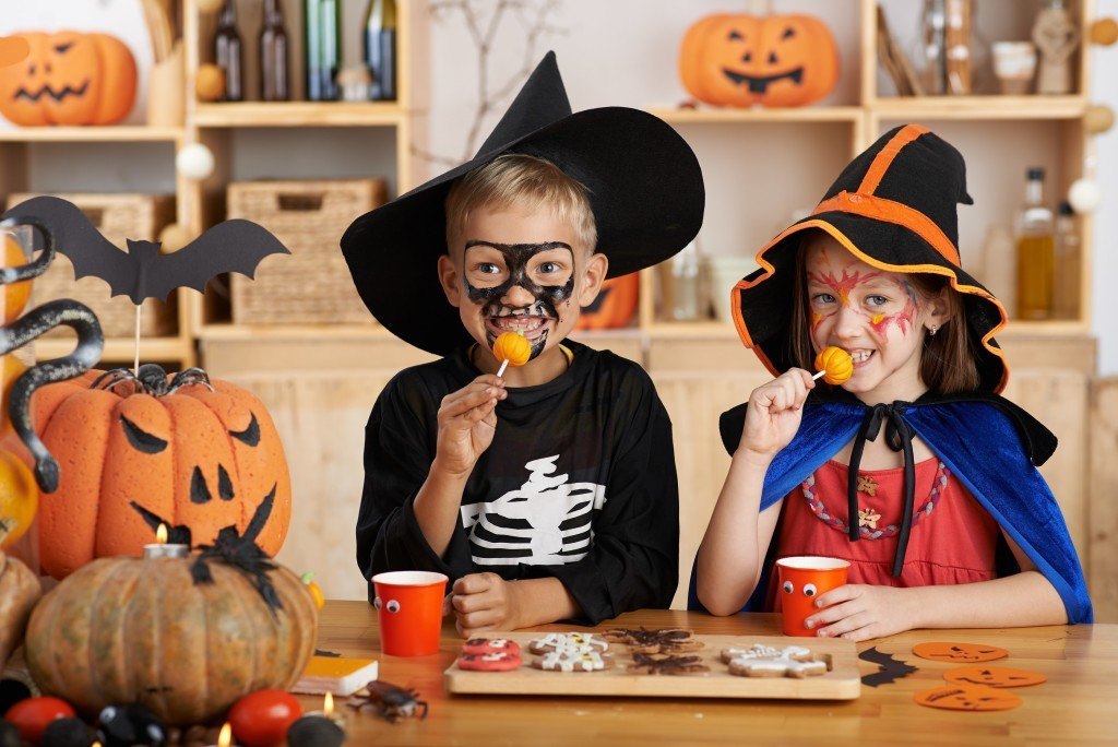 Children eating Halloween treats at the party