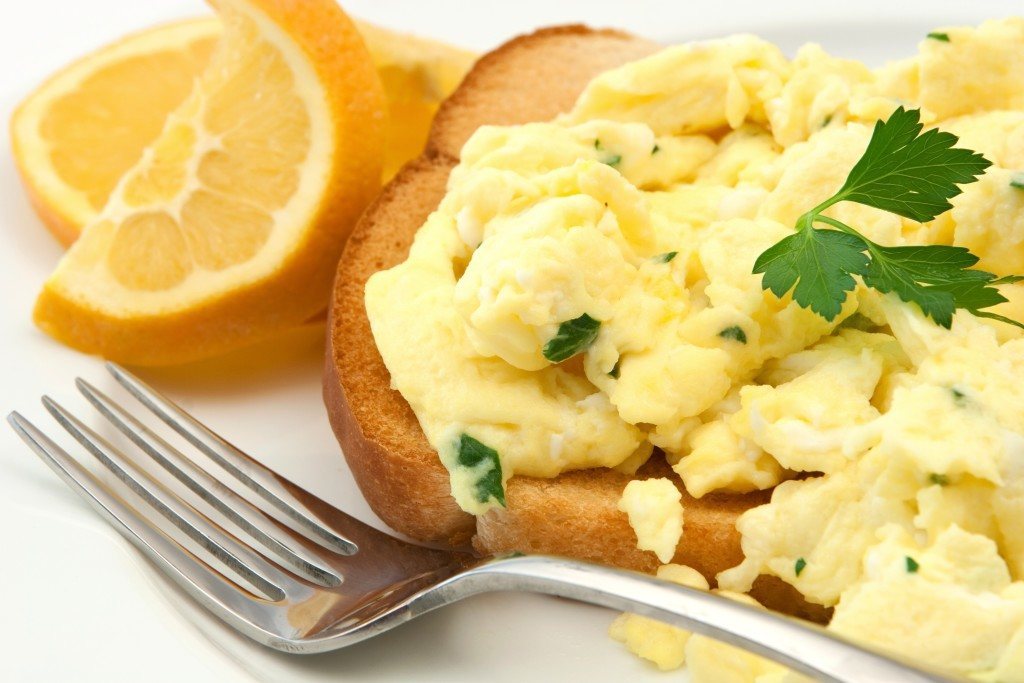 Scrambled Egg Breakfast freshly prepared on a white plate