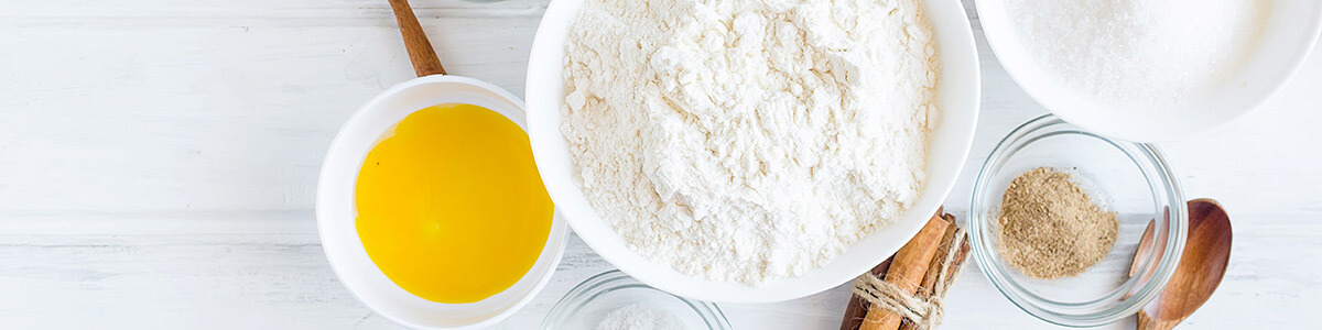 flour, butter, cinnamon and sugar on table