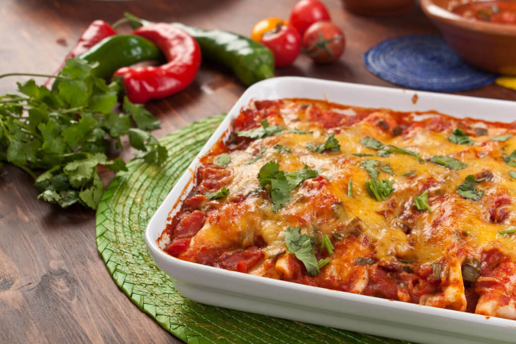 tray of turkey enchiladas in baking dish on table