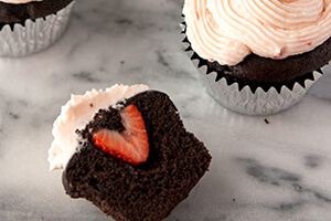 Chocolate cupcakes with strawberry cream cheese frosting