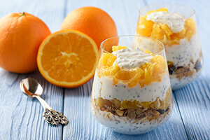 a creamsicle chia parfait with sliced oranges