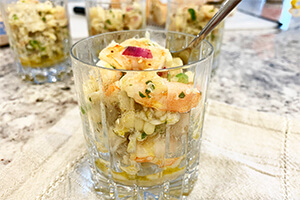 Crab and shrimp cocktail in a glass on the table