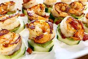 shrimp avocado cucumber bites on a plate