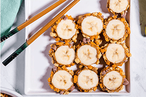 a crunchy banana roll recipe on a plate with chopsticks