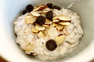 breakfast oats with chocolate chips and almonds in a bowl